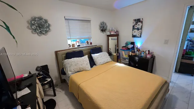 a bed room with a bed and a couch