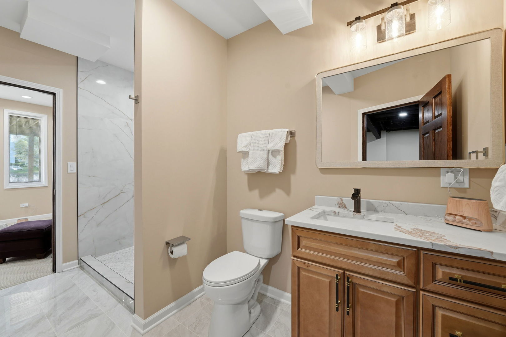 1406 Rue Paris Place Inverness, IL 60067 - Photo 27 of 35 a bathroom with a granite countertop toilet sink and mirror