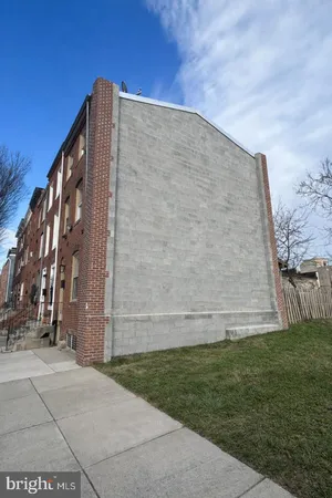 a brick building with a yard