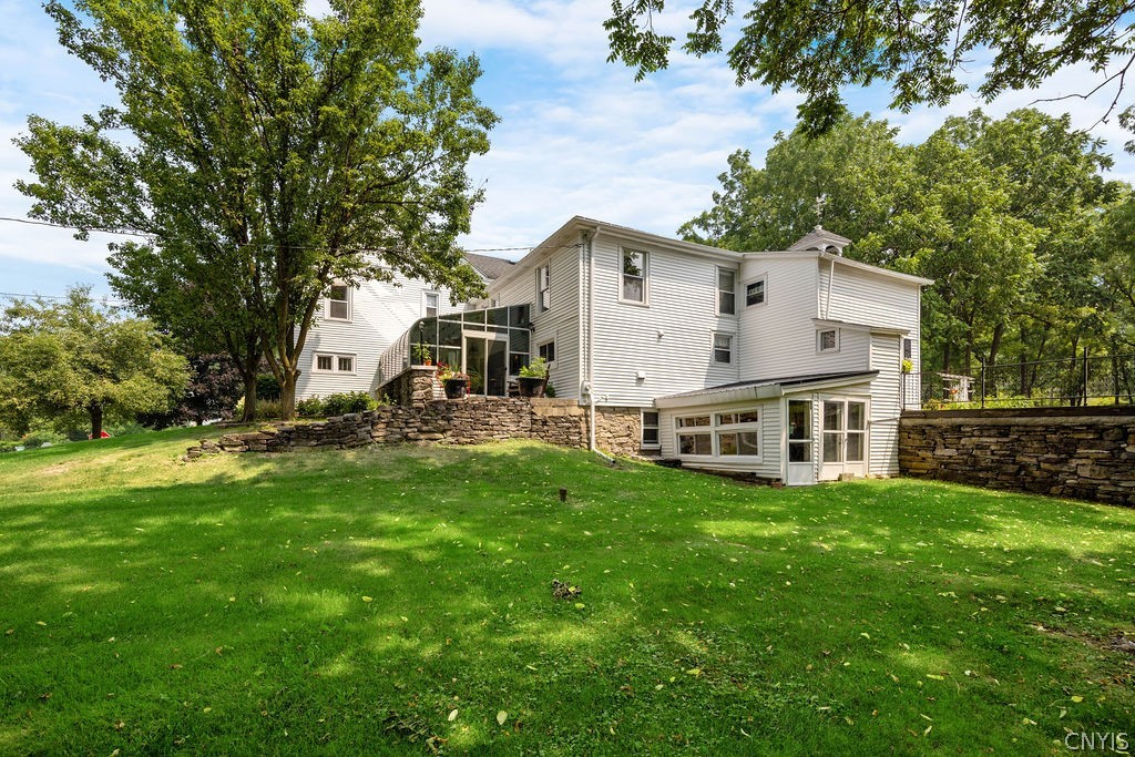 7942 Salt Springs Road Manlius, NY 13104 - Photo 45 of 50 View of the estate from the Duguid Road side. The lower level grass sits between the barn & home & is where the septic system is located.