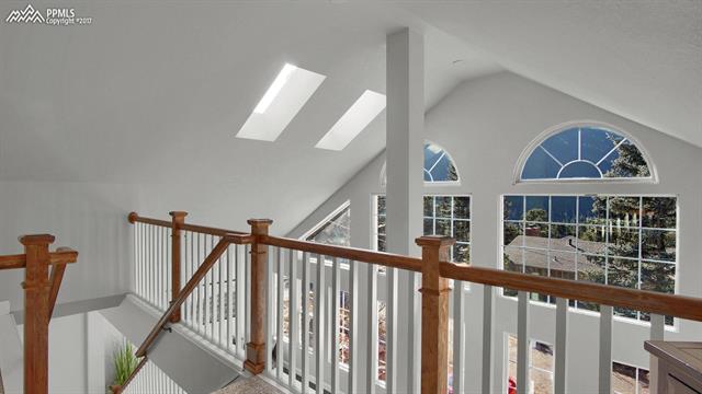 7850 Gardiner Road Cascade, CO 80809 - Photo 11 of 24 The steps off the living room provide a loft feel as you accend to the upper level. Skylights and windows provide plenty of light