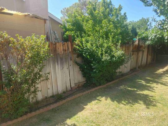 609 East Wilson Avenue Ridgecrest, CA 93555 - Photo 25 of 32 a view of a water fountain with wooden fence
