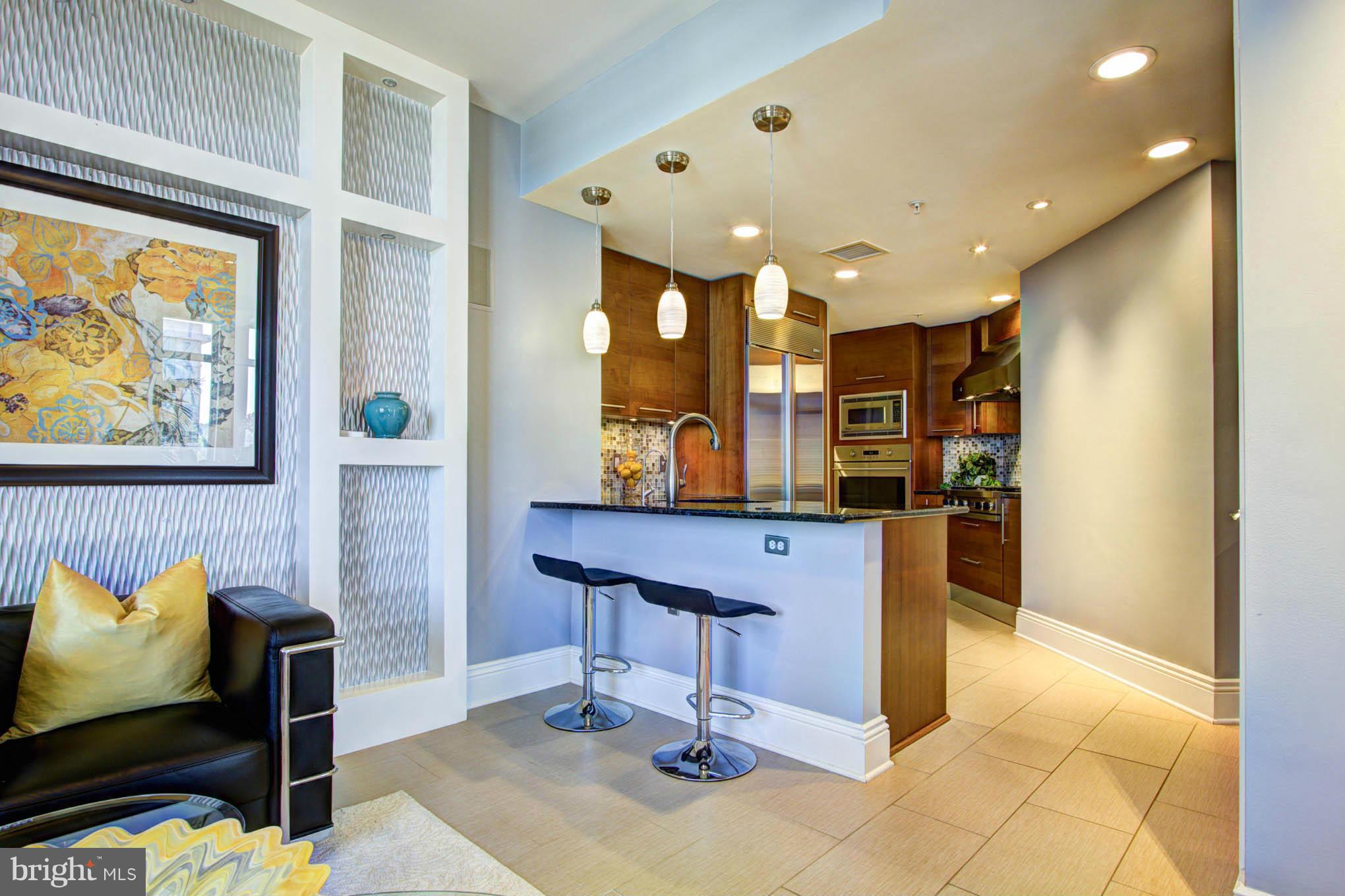 11990 Market Street, Unit 1002 Reston, VA 20190 - Photo 12 of 30 Family Room to Kitchen