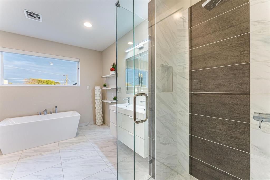 4013 Ivanhoe Lane Dallas, TX 75212 - Photo 19 of 38 Bathroom with vanity and independent shower and bath