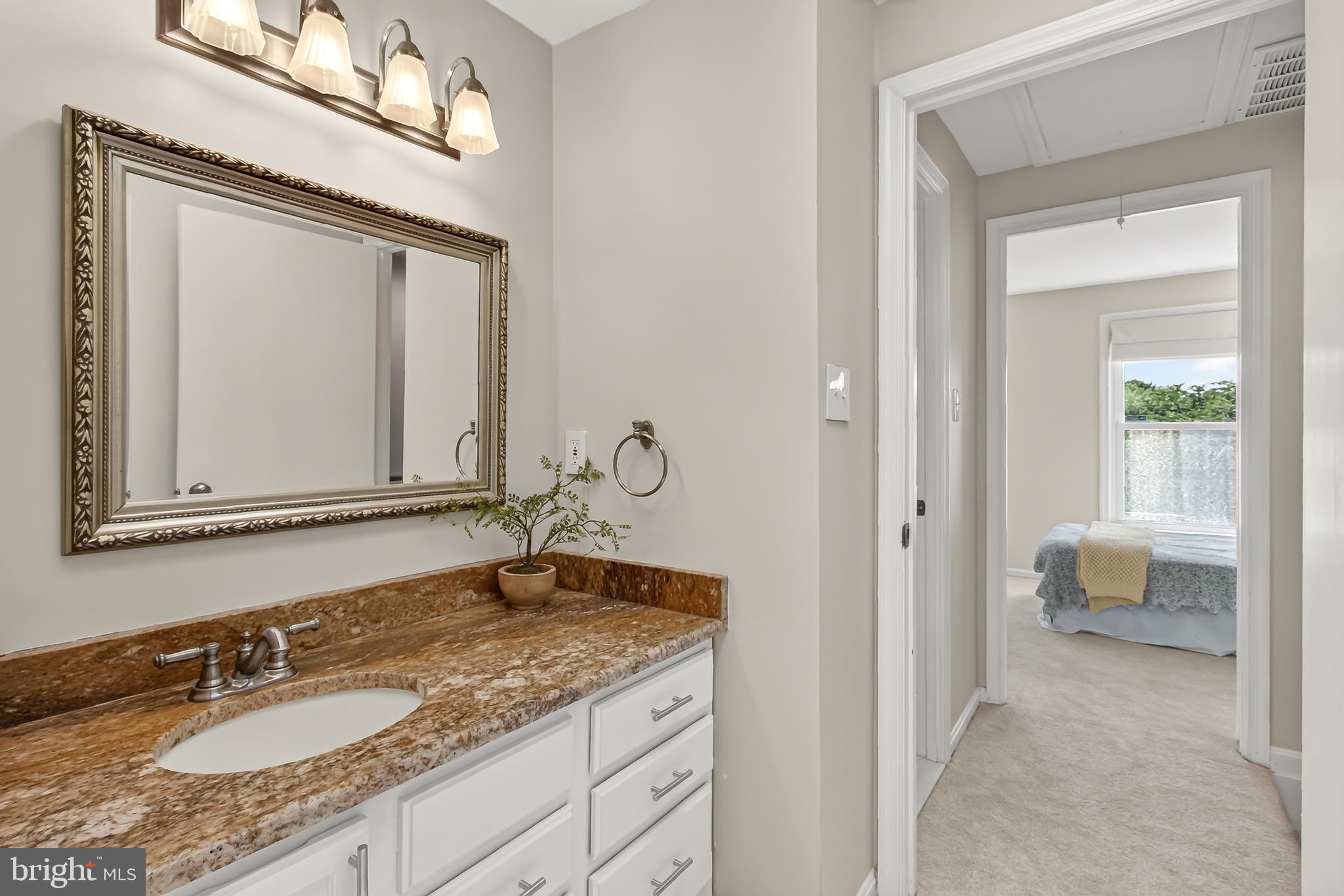 1769 Whisperhill Drive Reston, VA 20194 - Photo 30 of 58 Ensuite dressing area w/ granite top vanity & sink