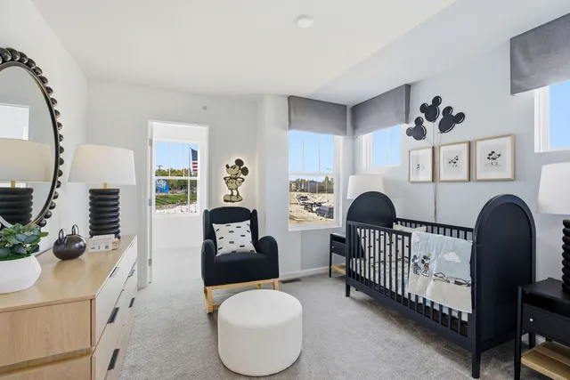 a bedroom with furniture and a window