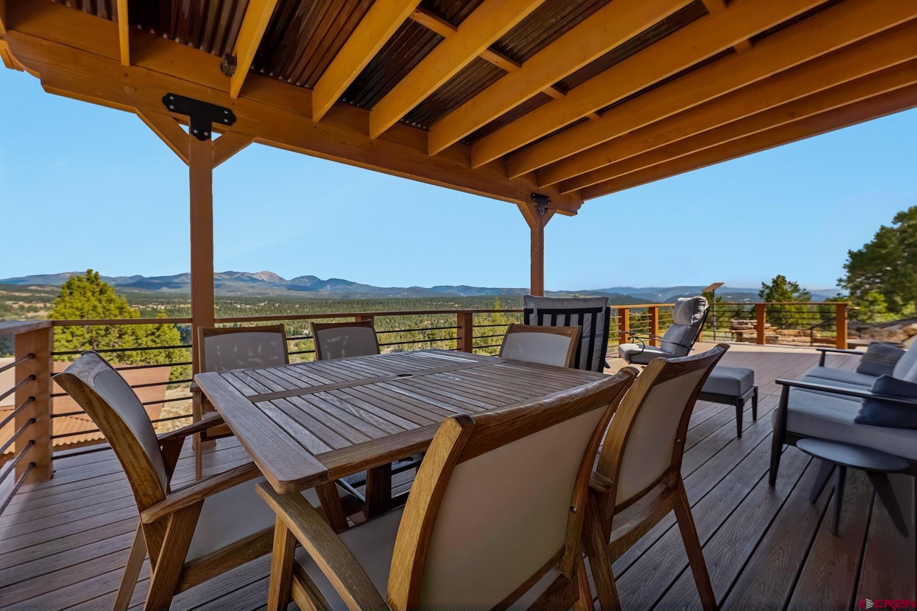 191 Deer Valley Road Hesperus, CO 81326 - Photo 12 of 45 a view of a dinning table and chairs on the roof deck