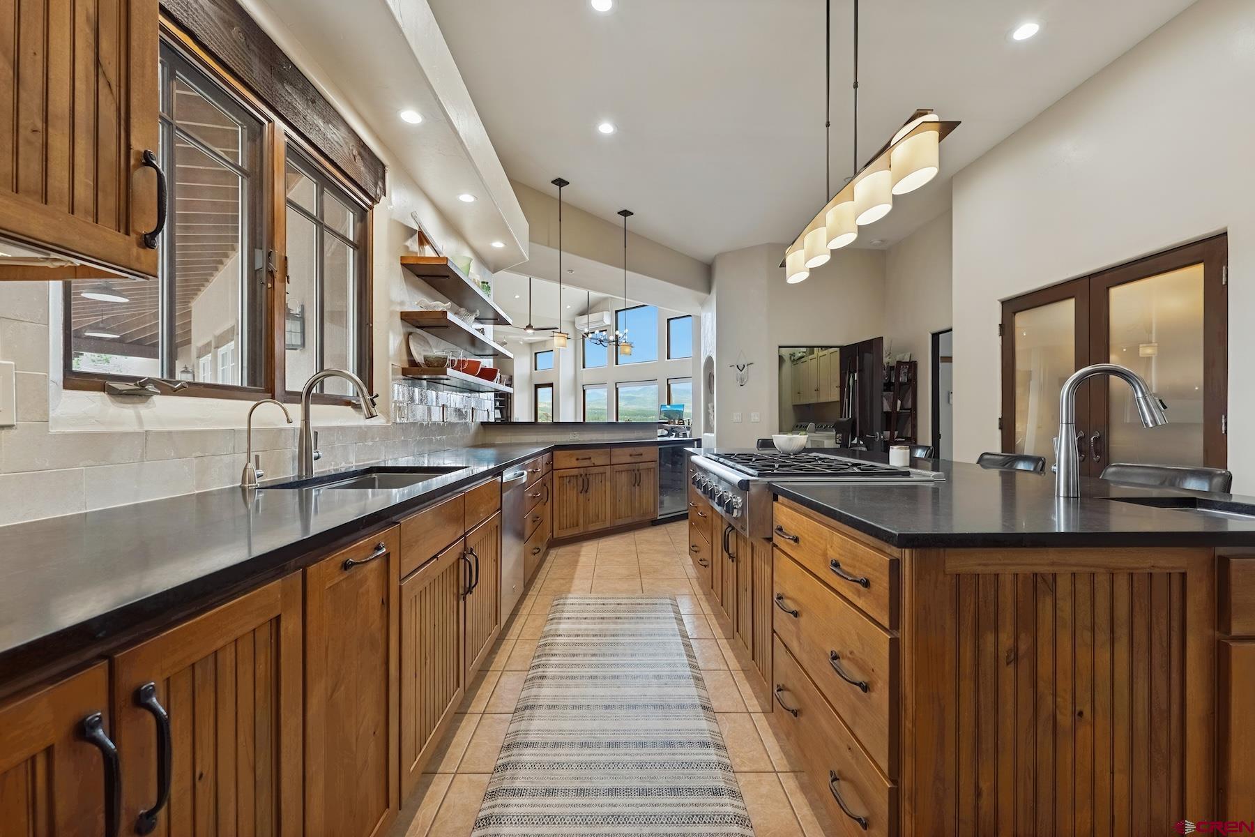 191 Deer Valley Road Hesperus, CO 81326 - Photo 16 of 45 a large kitchen with stainless steel appliances lots of counter space and a sink