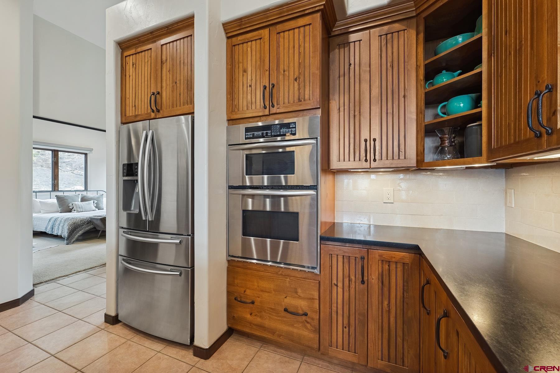 191 Deer Valley Road Hesperus, CO 81326 - Photo 17 of 45 a kitchen with stainless steel appliances granite countertop a refrigerator and a cabinets