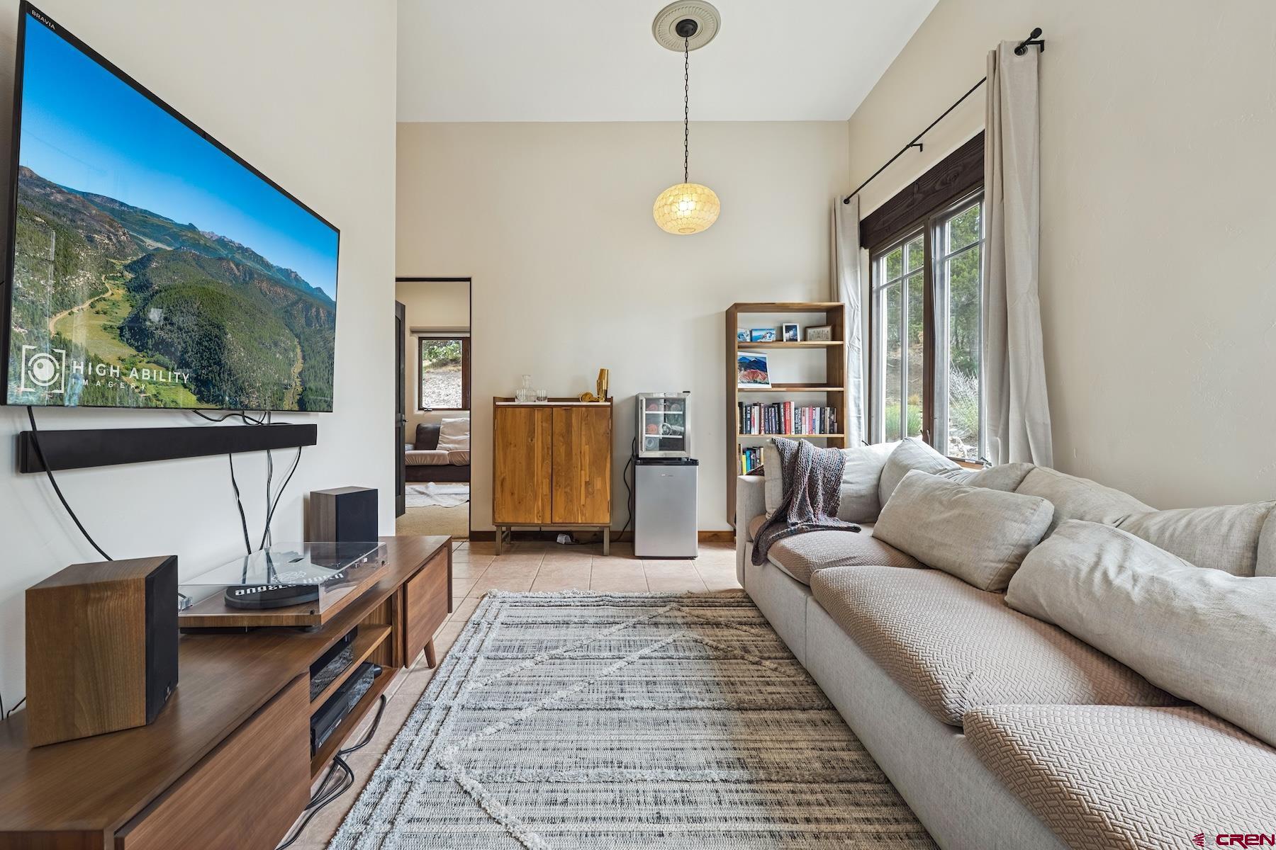191 Deer Valley Road Hesperus, CO 81326 - Photo 31 of 45 a living room with furniture a window and a flat screen tv