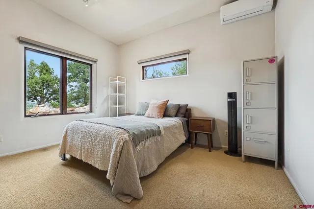 a spacious bathroom with a granite countertop tub sink and mirror