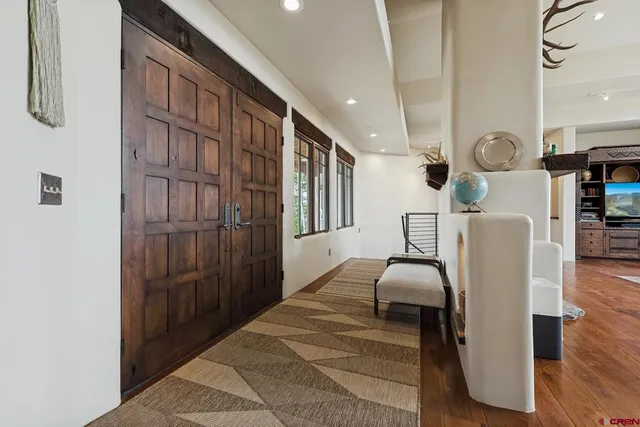 a bedroom with furniture and wooden floor