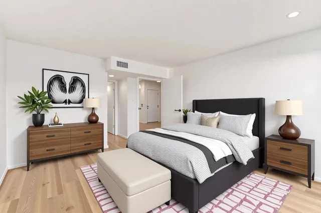 a bedroom with a bed and a dresser