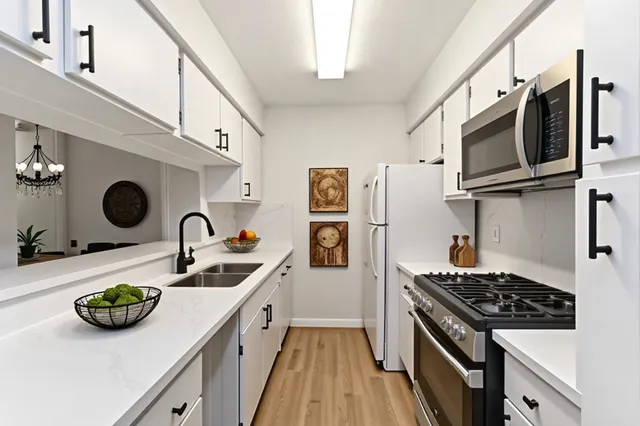 a kitchen with a stove and a sink