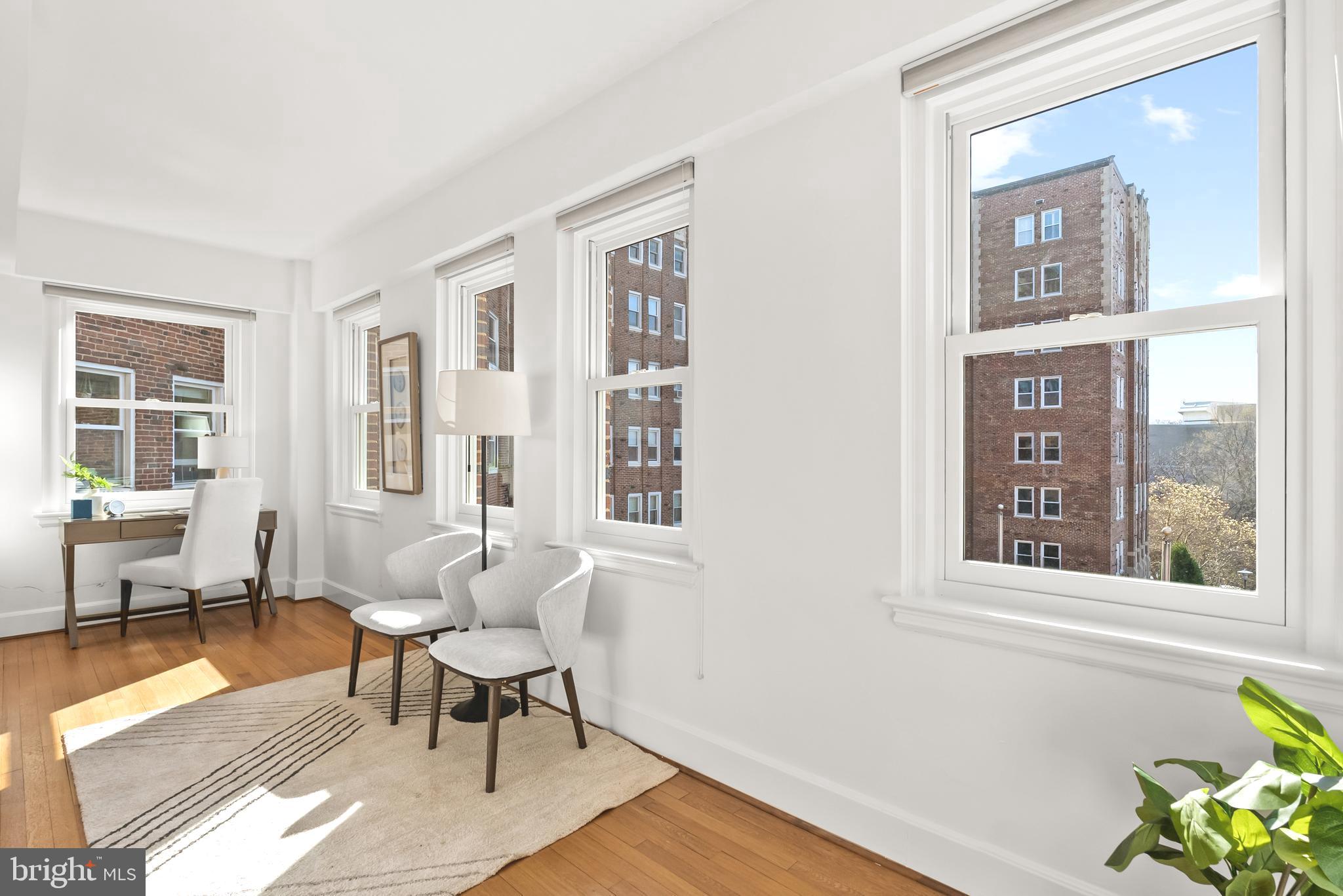 3601 Connecticut Avenue Northwest, Unit 409 Washington, DC 20008 - Photo 11 of 44 a living room with furniture and windows