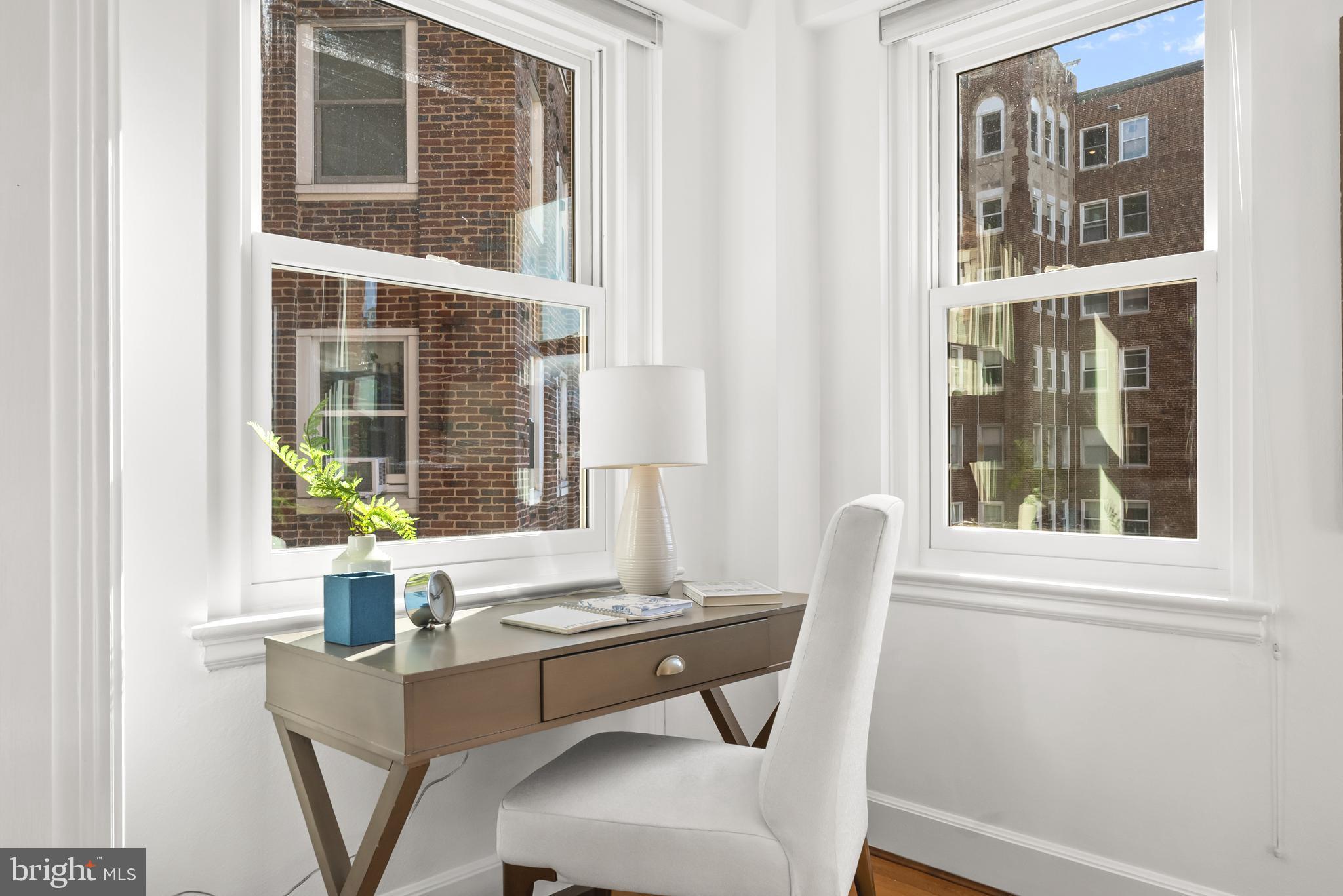 3601 Connecticut Avenue Northwest, Unit 409 Washington, DC 20008 - Photo 13 of 44 a view of a room that has a couch and a window