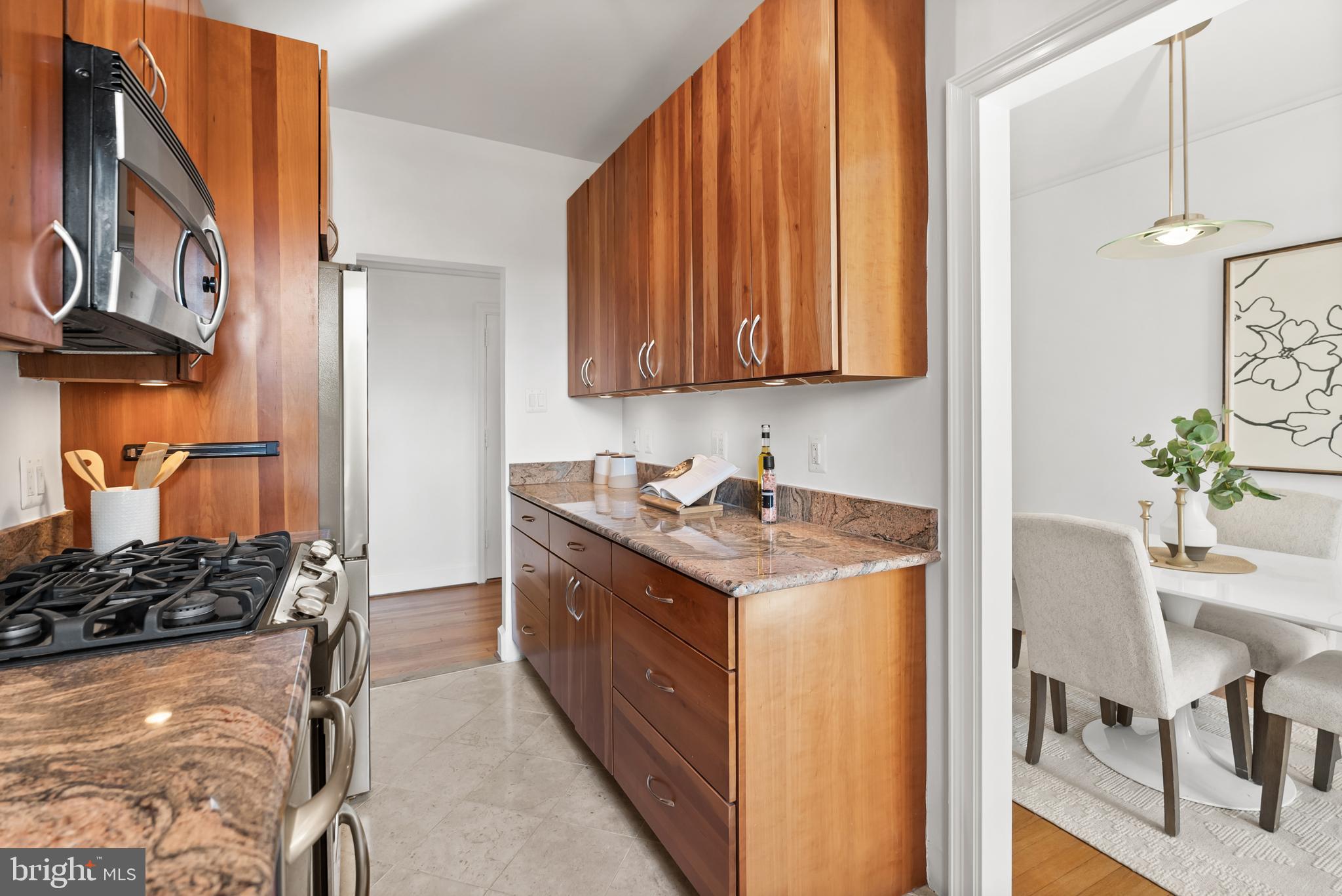 3601 Connecticut Avenue Northwest, Unit 409 Washington, DC 20008 - Photo 18 of 44 a kitchen with a sink stove and cabinets