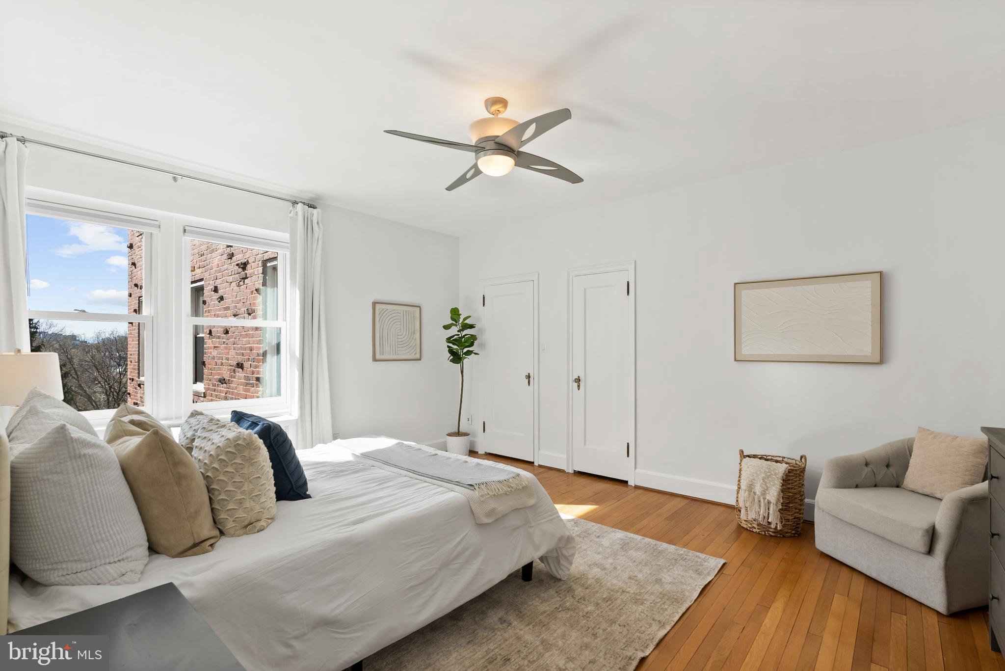 3601 Connecticut Avenue Northwest, Unit 409 Washington, DC 20008 - Photo 23 of 44 a bedroom with a bed and a couch