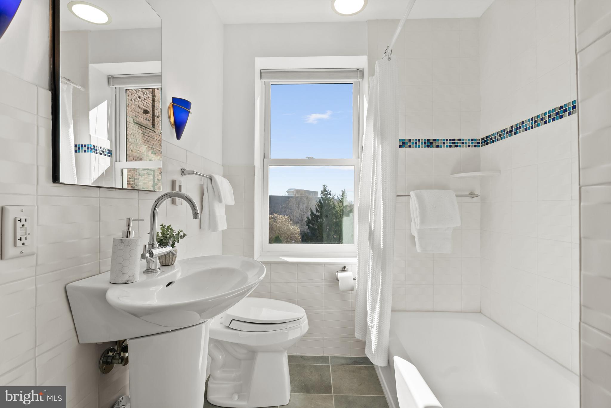 3601 Connecticut Avenue Northwest, Unit 409 Washington, DC 20008 - Photo 27 of 44 a bathroom with a sink toilet and shower