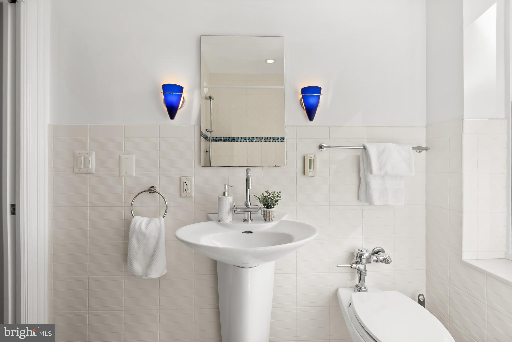 3601 Connecticut Avenue Northwest, Unit 409 Washington, DC 20008 - Photo 28 of 44 a bathroom with a sink and a mirror