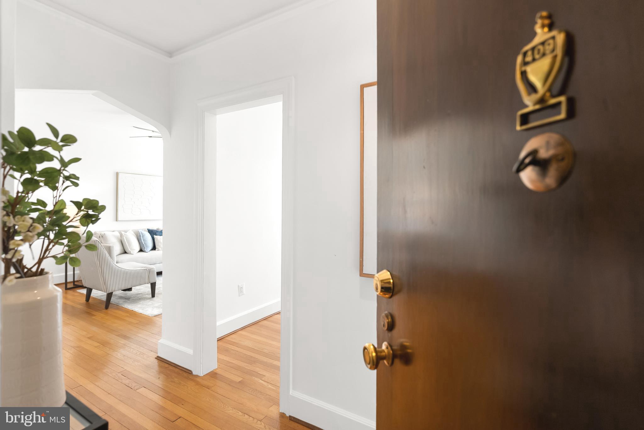 3601 Connecticut Avenue Northwest, Unit 409 Washington, DC 20008 - Photo 5 of 44 a view of a hallway with wooden floor