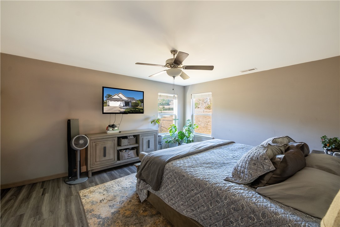 400 Green View Court Westminster, SC 29693 - Photo 16 of 33 This tranquil bedroom offers comfort and a connection to the outdoors through expansive windows.