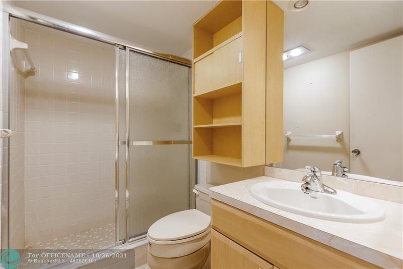 3520 Oaks Way, Unit 607 Pompano Beach, FL 33069 - Photo 20 of 31 a bathroom with a sink toilet and shower