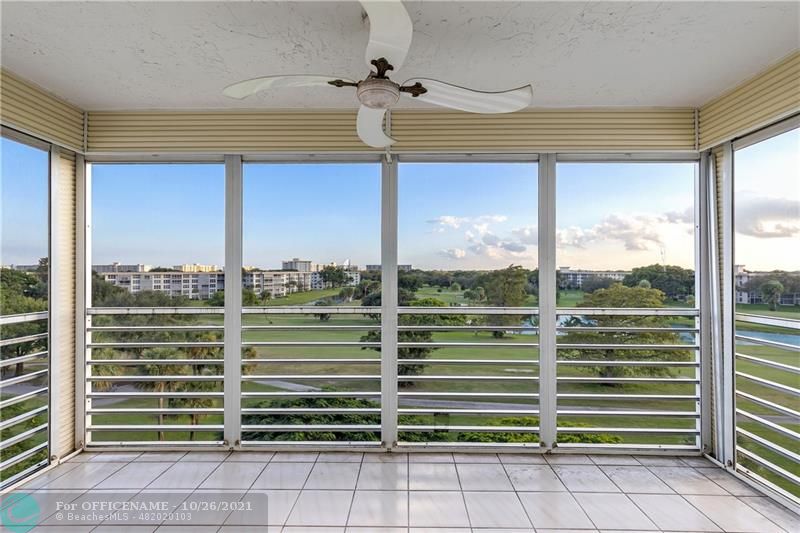 3520 Oaks Way, Unit 607 Pompano Beach, FL 33069 - Photo 2 of 31 a view of a room with a large window