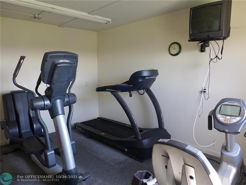 3520 Oaks Way, Unit 607 Pompano Beach, FL 33069 - Photo 31 of 31 a room with gym equipment