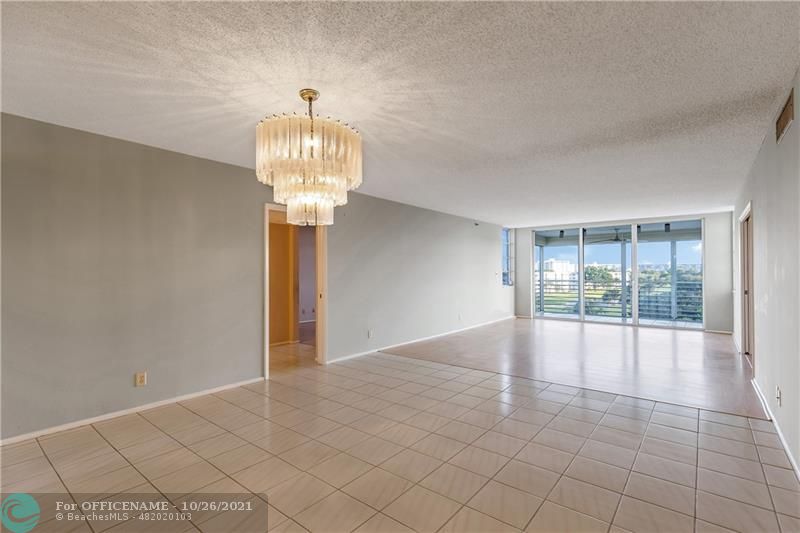 3520 Oaks Way, Unit 607 Pompano Beach, FL 33069 - Photo 6 of 31 a view of an empty room and window