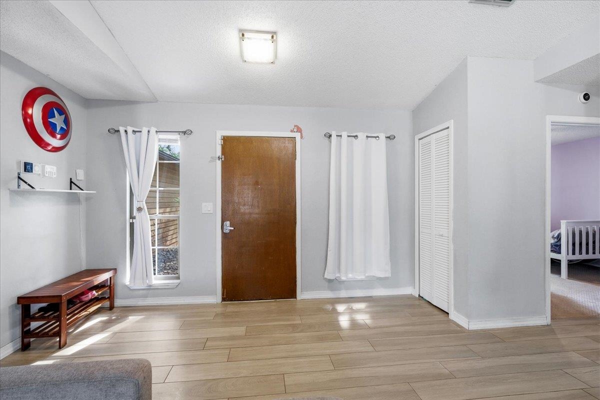 204 Queen Road St. Augustine, FL 32086 - Photo 11 of 55 Entrance foyer featuring light wood-style floors and a textured ceiling