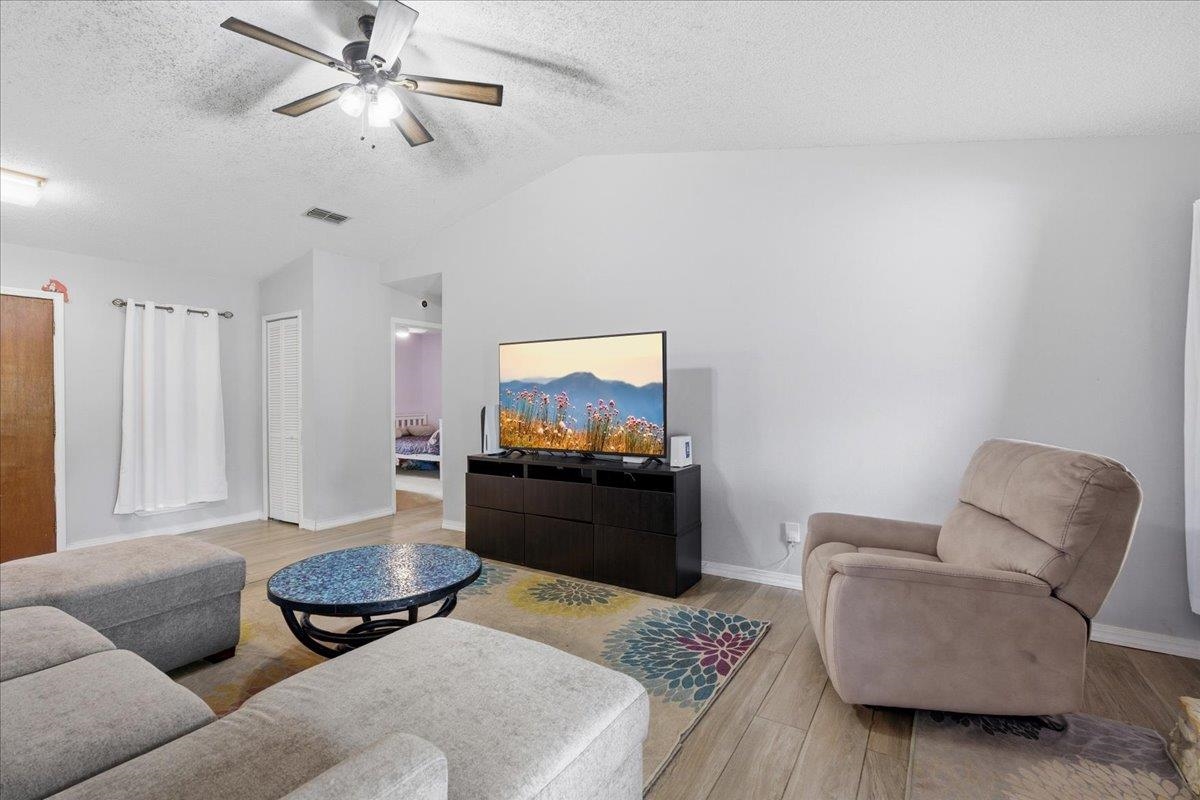 204 Queen Road St. Augustine, FL 32086 - Photo 13 of 55 Living area featuring light wood finished floors and a ceiling fan
