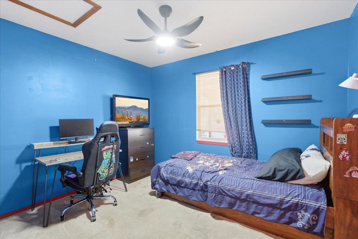 204 Queen Road St. Augustine, FL 32086 - Photo 27 of 55 Carpeted bedroom with a desk and a ceiling fan