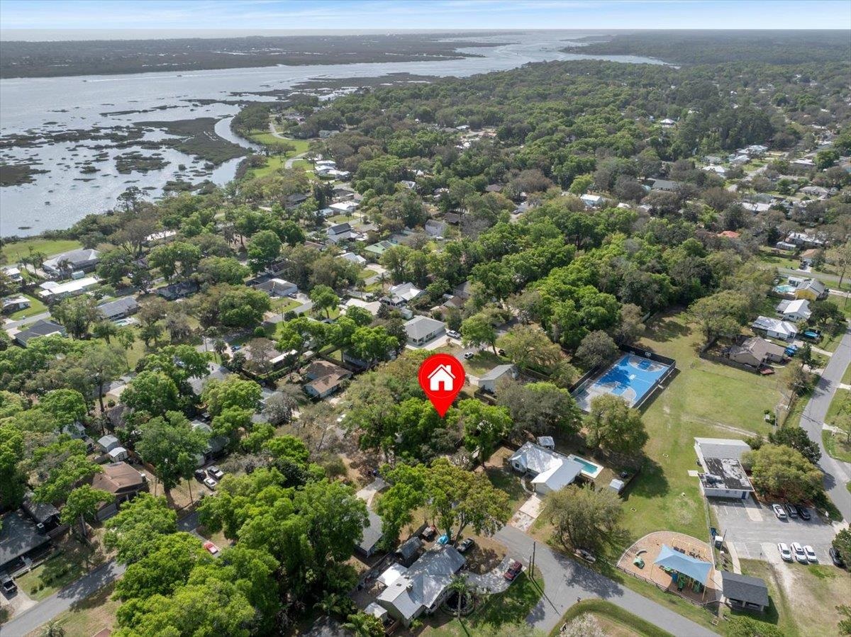 204 Queen Road St. Augustine, FL 32086 - Photo 50 of 55 Aerial view of residential area with a nearby body of water and a forest