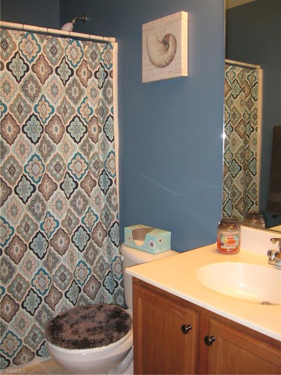 6960 Rangecrest Road Belews Creek, NC 27009 - Photo 12 of 26 Hall Bathroom with a tub/shower combo and single sink. Also has a Linen closet.