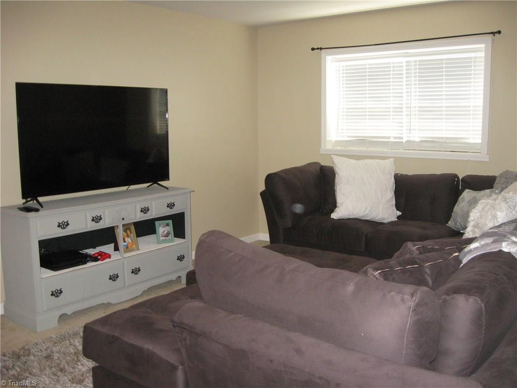 6960 Rangecrest Road Belews Creek, NC 27009 - Photo 16 of 26 Den area in the Basement . . Large space for a Movie room, Play room, of you could even make it a downstairs Master!!!!