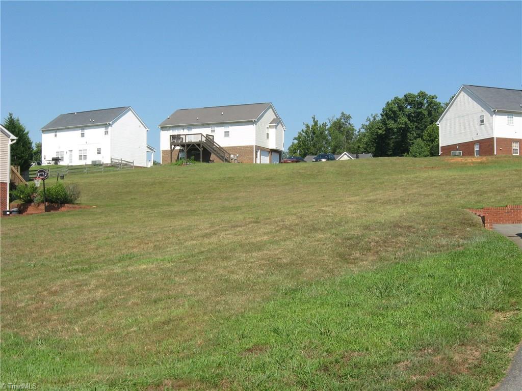 6960 Rangecrest Road Belews Creek, NC 27009 - Photo 22 of 26 From the road in front of the house . . this is your view to the leftt of the house.