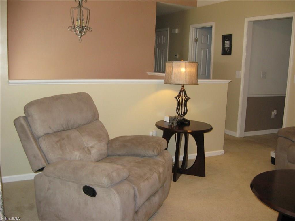 6960 Rangecrest Road Belews Creek, NC 27009 - Photo 5 of 26 Another view of the Living room that shows the entry and the entrance of the Kitchen that is thru the door to the right.
