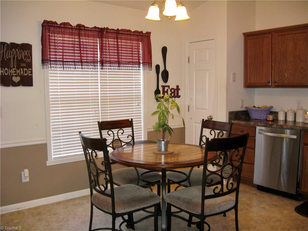 6960 Rangecrest Road Belews Creek, NC 27009 - Photo 6 of 26 Eat-in Kitchen area that opens out to the deck and backyard. Has a handy Pantry and a stainless Dishwasher.
