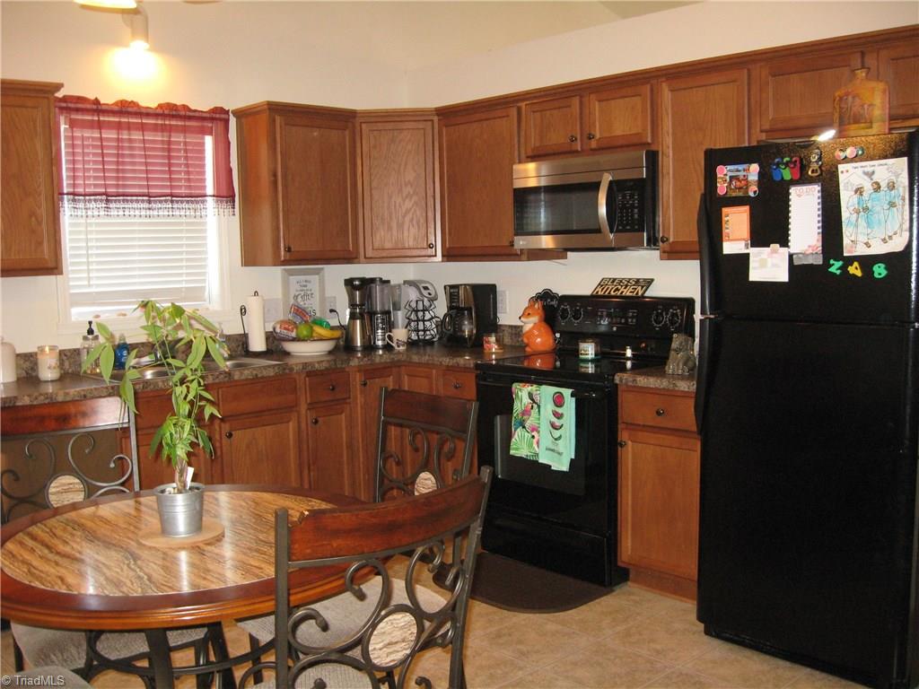 6960 Rangecrest Road Belews Creek, NC 27009 - Photo 7 of 26 Another view of the Kitchen . . . also has a vaulted ceiling!!!