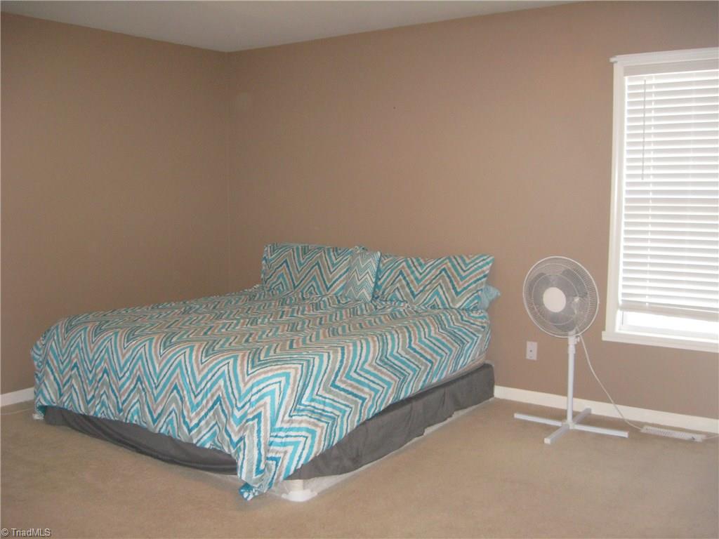 6960 Rangecrest Road Belews Creek, NC 27009 - Photo 8 of 26 Large Master Bedroom . . . this is a King size bed and you can see that there is still plenty of space. Also has a nice size walk-in closet!