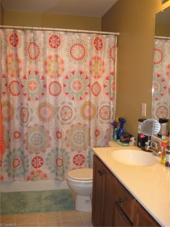 6960 Rangecrest Road Belews Creek, NC 27009 - Photo 9 of 26 Master Bath with a tub/shower combo and double sinks.