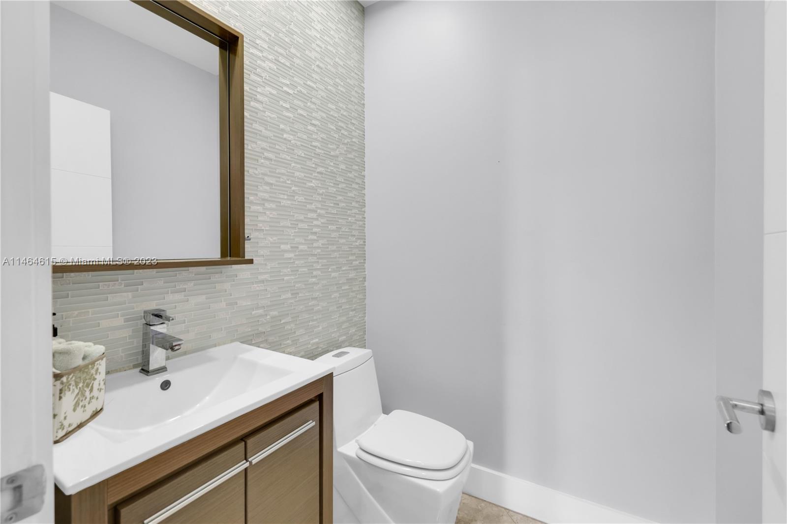 3015 Northeast 208th Street, Unit 3015 Aventura, FL 33180 - Photo 21 of 53 a bathroom with a sink and a toilet