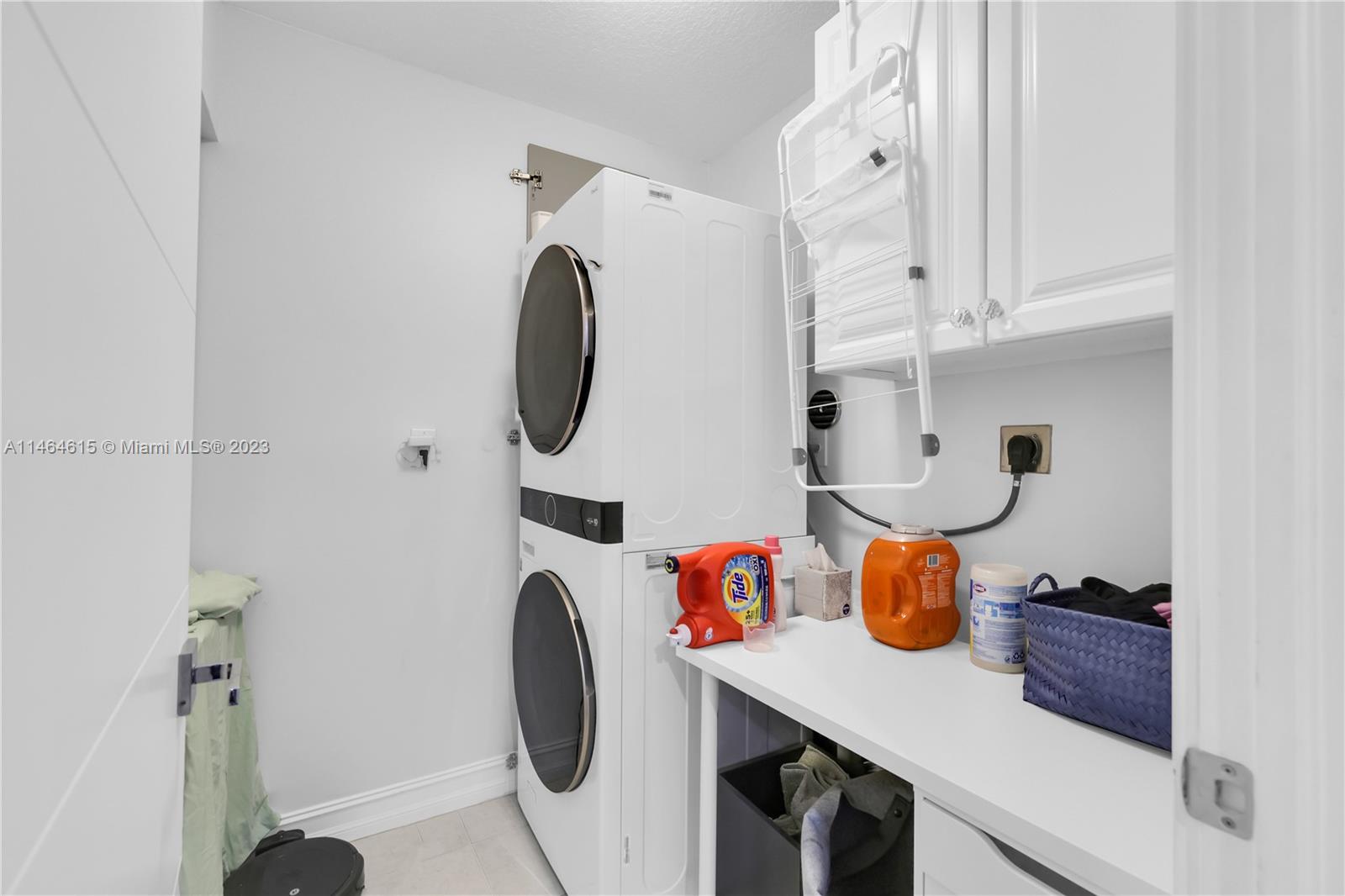 3015 Northeast 208th Street, Unit 3015 Aventura, FL 33180 - Photo 32 of 53 a room with toys and white cabinets