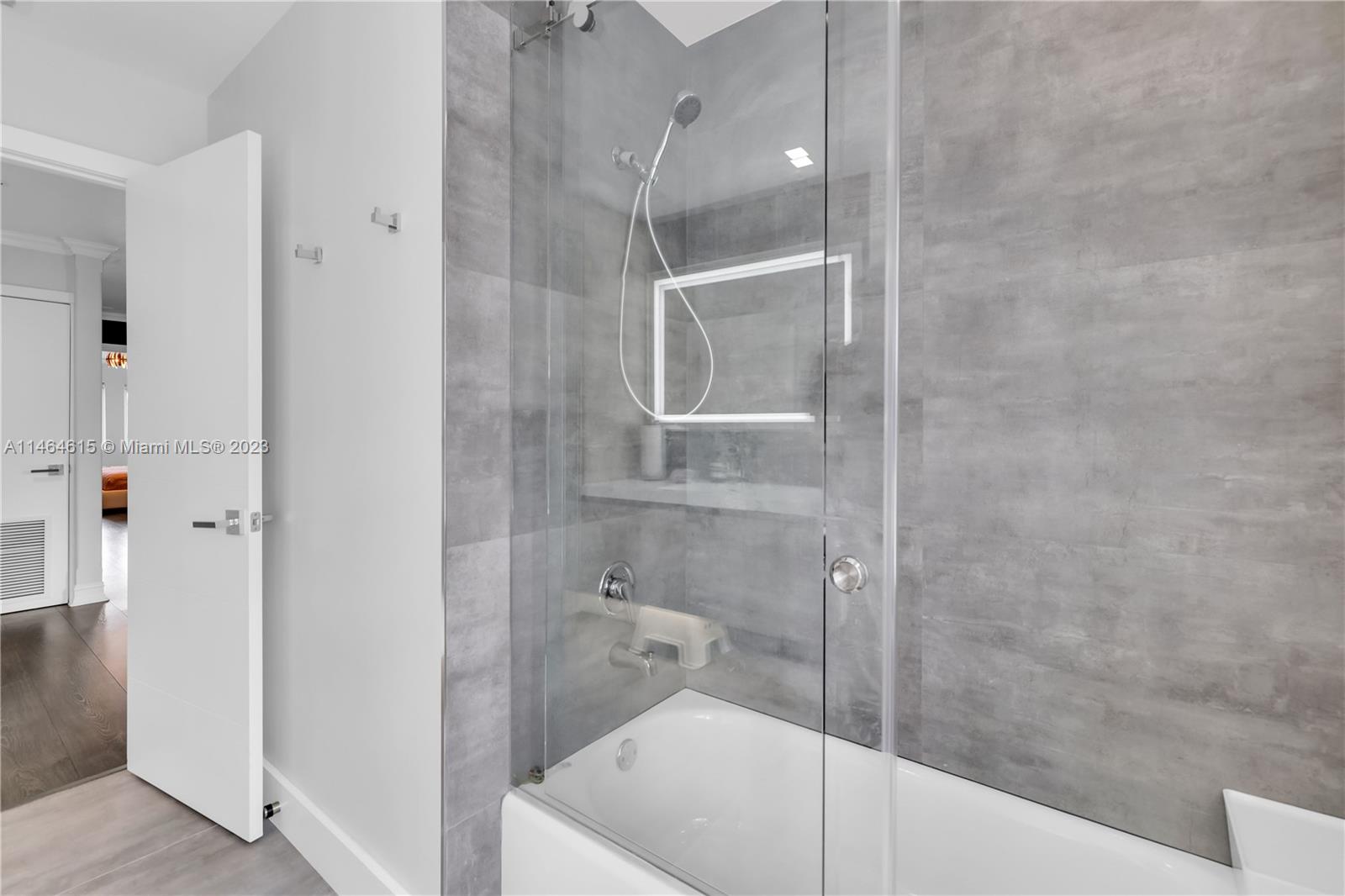 3015 Northeast 208th Street, Unit 3015 Aventura, FL 33180 - Photo 38 of 53 a bathroom with a bathtub and a shower
