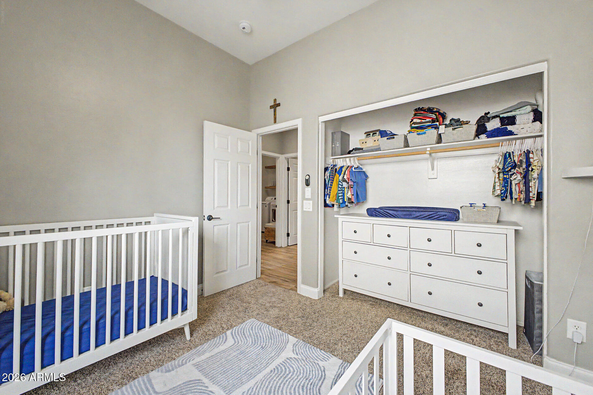 4272 East Buckboard Road Gilbert, AZ 85297 - Photo 27 of 37 a view of a bedroom with baby crib and furniture