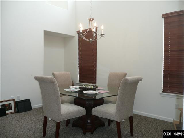 460 Sysonby Court Reno, NV 89521 - Photo 3 of 8 a view of a dining room with furniture and wooden floor