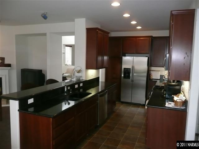 460 Sysonby Court Reno, NV 89521 - Photo 5 of 8 a kitchen with a refrigerator and a sink