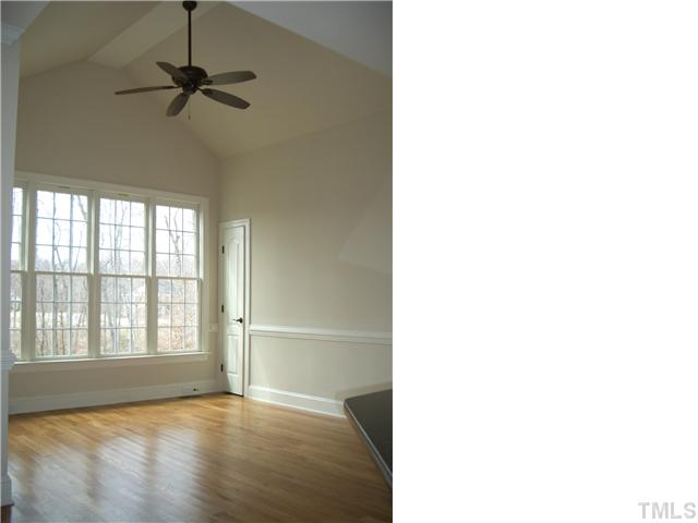 2809 Winter Song Road, Unit 2738 Raleigh, NC 27614 - Photo 7 of 12 Vaulted Casual Den Area located directly off the Kitchen overlooking into the privacy of the wooded back yard!
