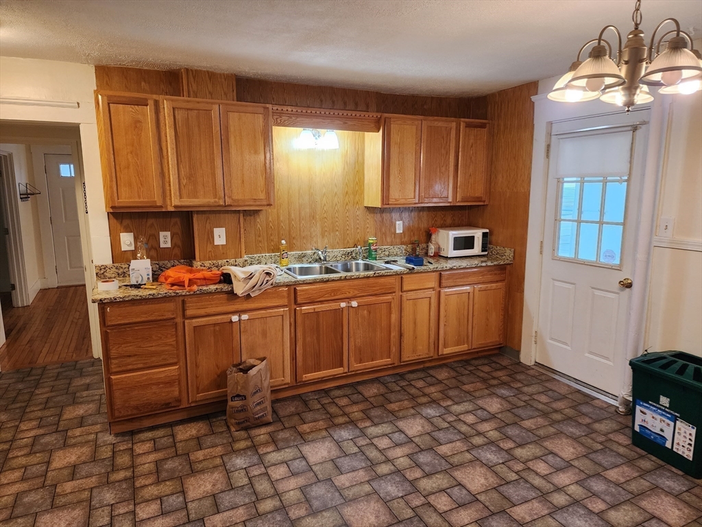 1260 Grafton Street Worcester, MA 01604 - Photo 11 of 42 a kitchen with sink cabinets and window